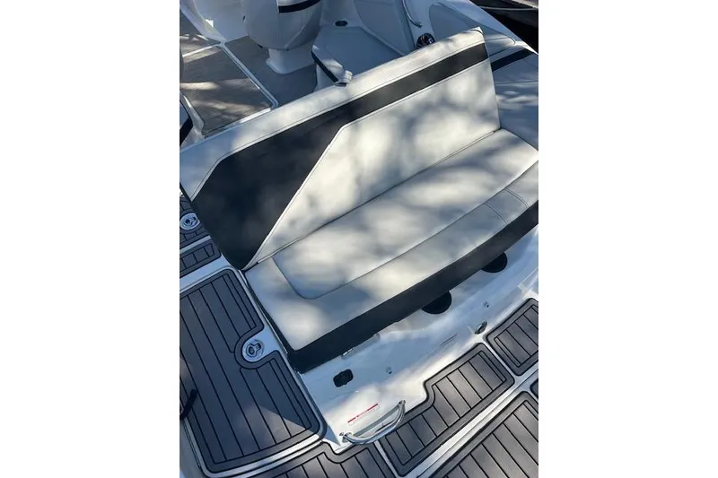 Slide: The Image of 2022 Sea Ray SPX 210 boat with sleek seating and modern deck design. - 10