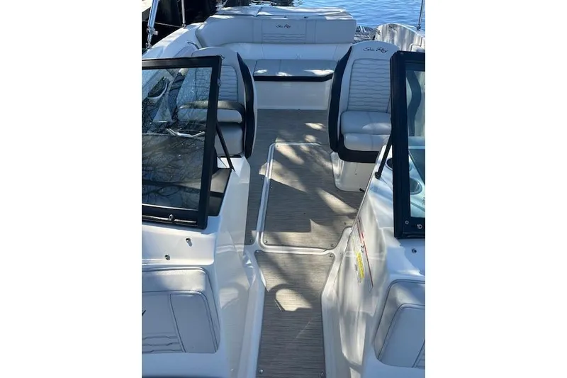 Slide: The Image of 2022 Sea Ray SPX 210 boat interior with seating and open deck view. - 28
