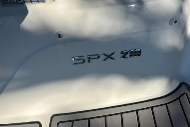 Slide: The Image of 2022 Sea Ray SPX 210 boat logo on deck, showcasing model branding. - 3