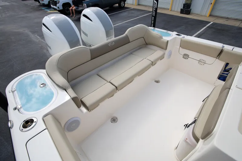 Slide: The Image of 2023 Key West 263 FS boat interior with seating and Yamaha engines. - 11
