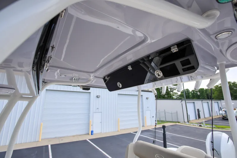 Slide: The Image of 2023 Key West 263 FS boat interior, featuring sleek overhead storage and modern design elements. - 20