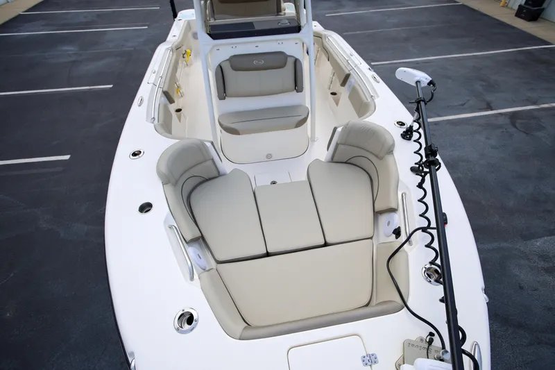 Slide: The Image of 2023 Key West 263 FS boat interior with cushioned seating and fishing equipment. - 23