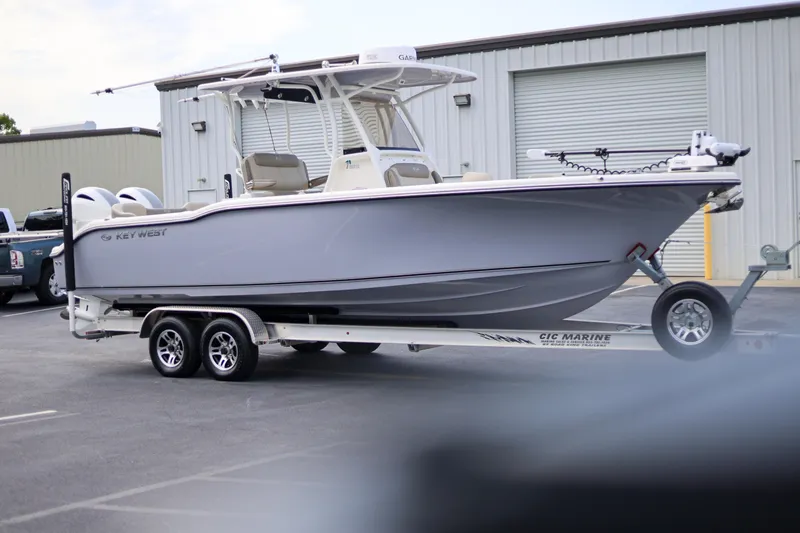 Slide: The Image of 2023 Key West 263 FS boat on trailer in parking lot. - 3