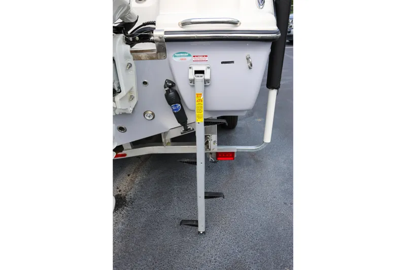Slide: The Image of 2023 Key West 263 FS boat with a mounted boarding ladder on the stern. - 8