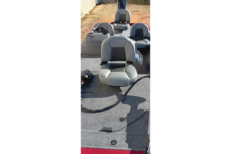 Slide: The Image of 2026 Tracker Bass Tracker Classic XL boat interior with gray seating and carpeted deck. - 10