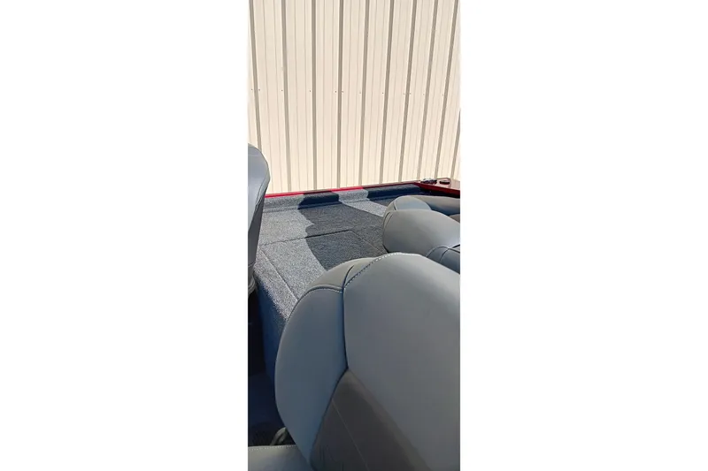 Slide: The Image of 2026 Tracker Bass Tracker Classic XL boat interior with gray seating and carpeted floor. - 14