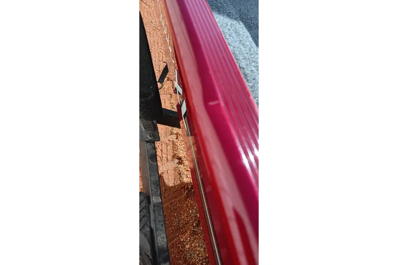 Slide: The Image of Close-up of 2026 Tracker Bass Tracker Classic XL boat edge and trailer. - 17