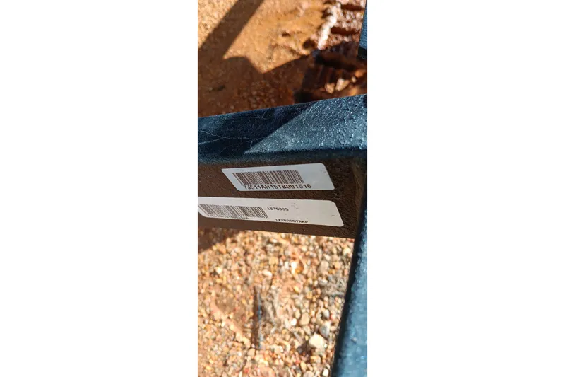 Slide: The Image of Close-up of 2026 Tracker Bass Tracker Classic XL serial number on metal frame. - 21