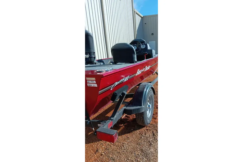 Slide: The Image of 2026 Tracker Bass Tracker Classic XL boat on trailer, parked outdoors. - 24