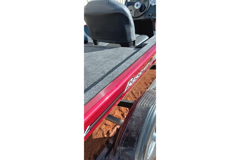 Slide: The Image of 2026 Tracker Bass Tracker Classic XL boat interior with red trim and seating. - 3