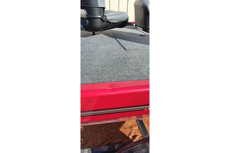 Slide: The Image of 2026 Tracker Bass Tracker Classic XL boat deck with seating, featuring red trim. - 4
