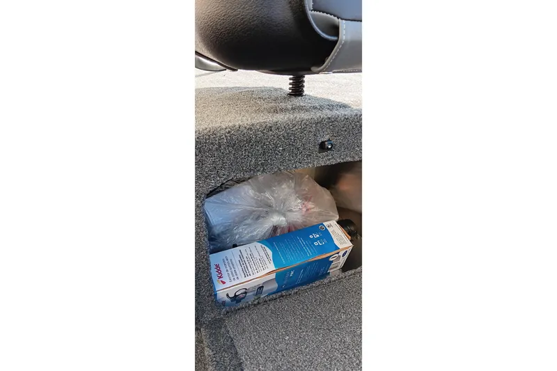 Slide: The Image of Storage compartment in 2026 Tracker Bass Tracker Classic XL boat with Kidde fire extinguisher box. - 5