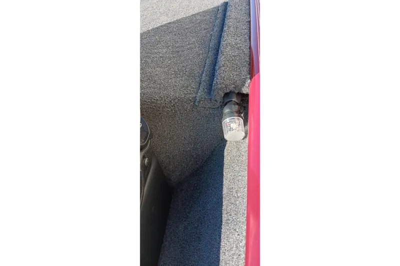 Slide: The Image of 2026 Tracker Bass Tracker Classic XL interior with gray carpet and light fixture. - 6