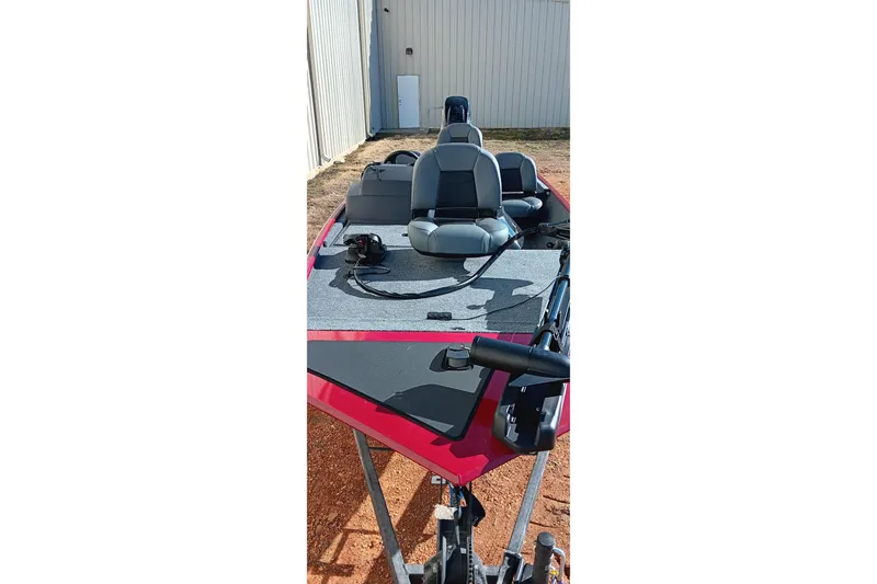 Slide: The Image of 2026 Tracker Bass Tracker Classic XL boat with gray seating and red accents. - 9