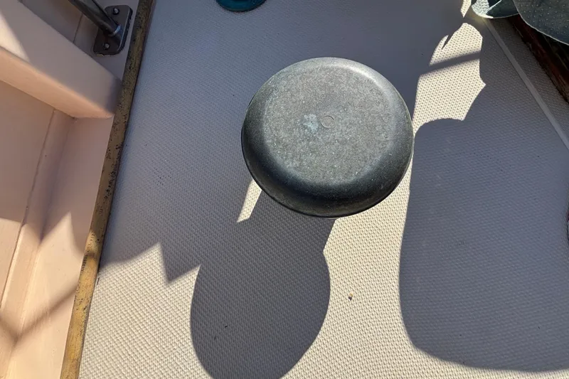 Slide: The Image of Deck of 1983 Bristol Channel Cutter 28 with a metal object casting a shadow. - 11