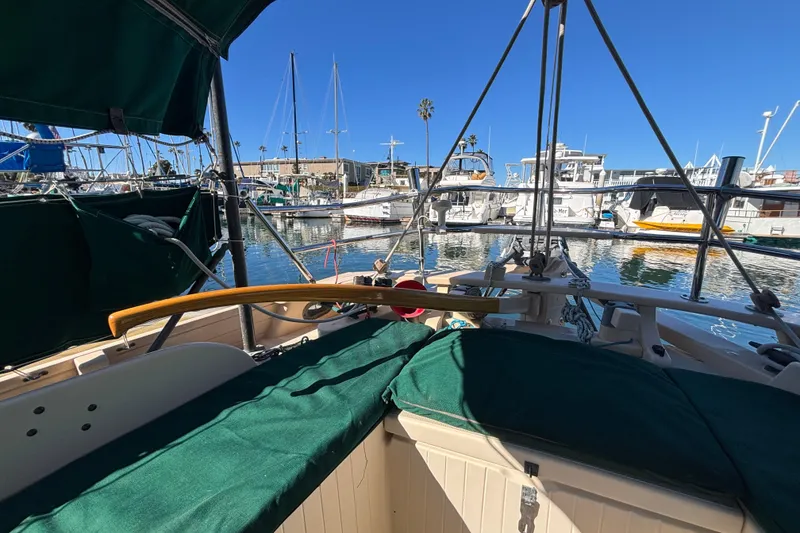 Slide: The Image of 1983 Bristol Channel Cutter 28 sailboat docked in a sunny marina. - 15