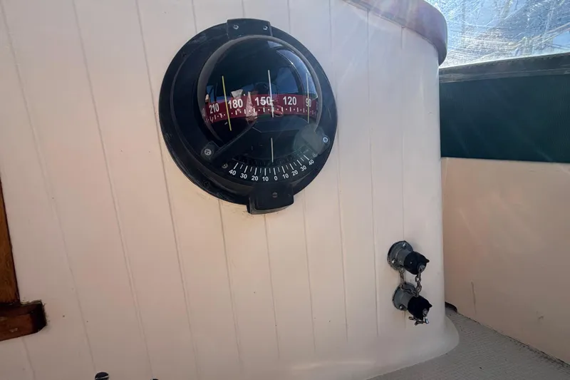 Slide: The Image of Compass on 1983 Bristol Channel Cutter 28 sailboat, mounted on white panel. - 17