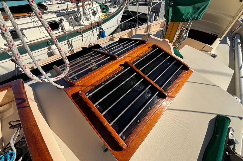 Slide: The Image of 1983 Bristol Channel Cutter 28 deck with wooden hatch and rigging details. - 2