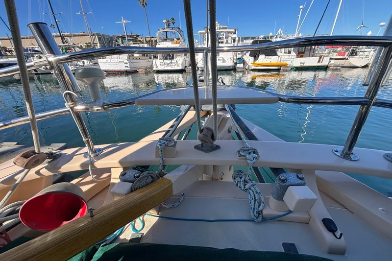 Slide: The Image of 1983 Bristol Channel Cutter 28 sailboat docked in a marina, featuring deck and rigging details. - 21