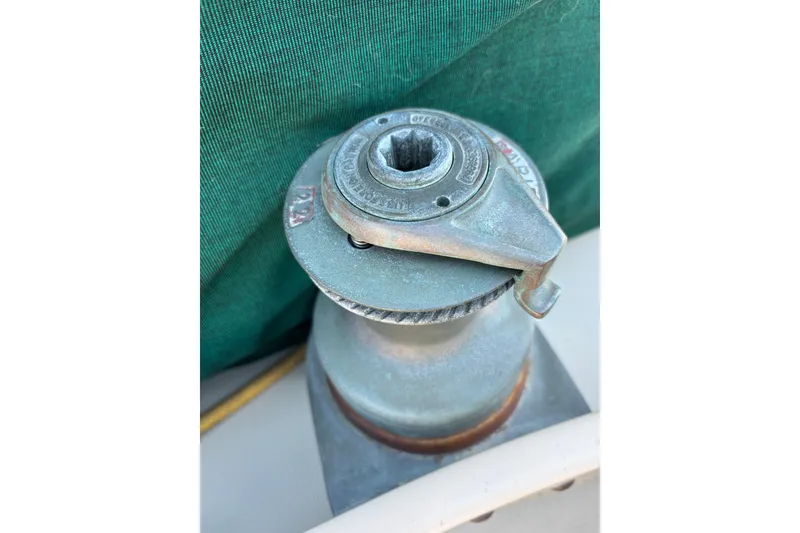 Slide: The Image of Winch on 1983 Bristol Channel Cutter 28 sailboat, with green canvas background. - 24