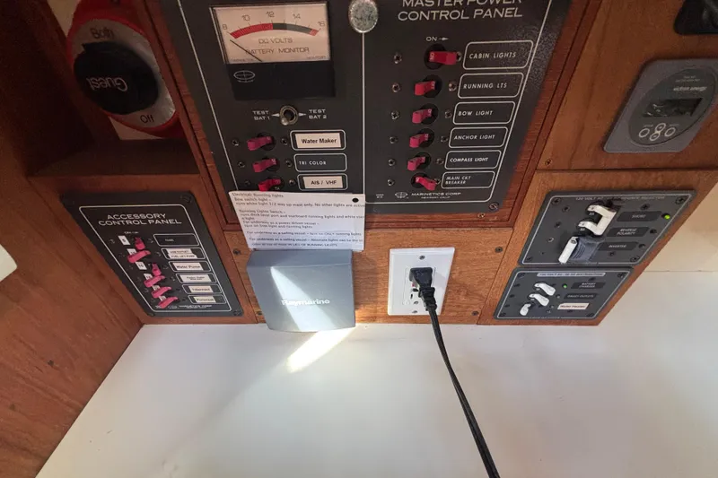 Slide: The Image of Control panel of a 1983 Bristol Channel Cutter 28 with various switches and gauges. - 31