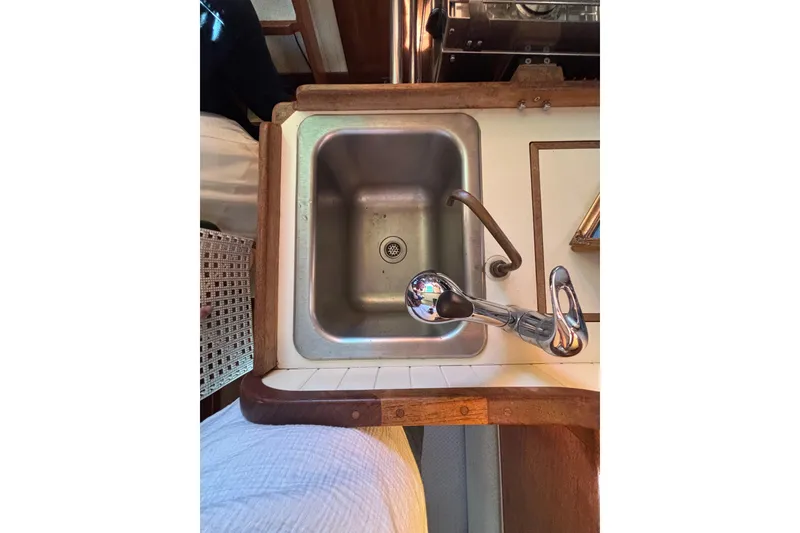 Slide: The Image of Stainless steel sink in 1983 Bristol Channel Cutter 28 boat galley. - 41