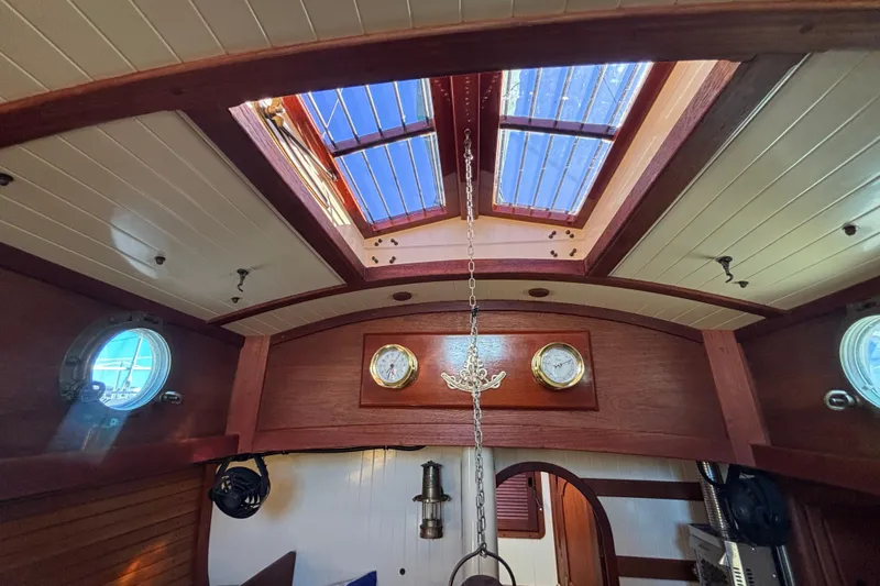 Slide: The Image of Interior of 1983 Bristol Channel Cutter 28 with wooden finish and skylight. - 45