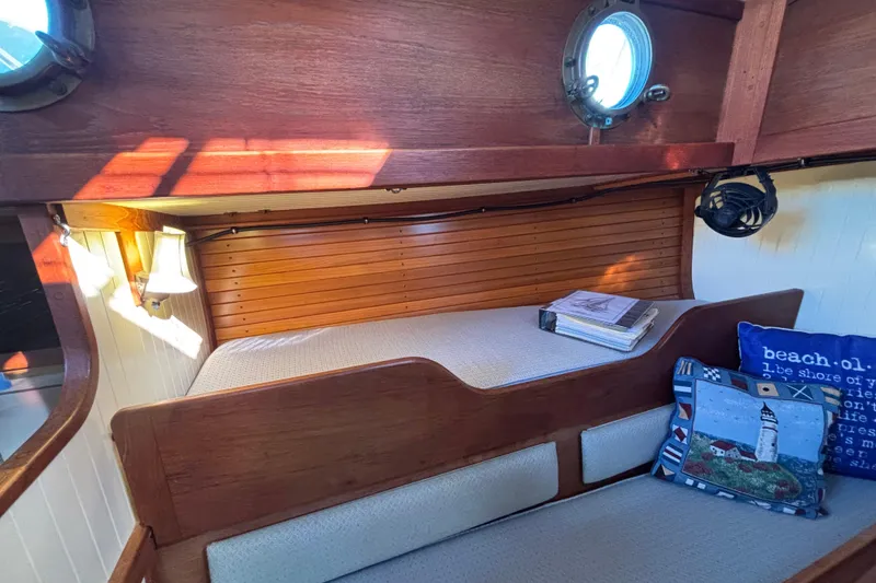Slide: The Image of Cozy cabin interior of 1983 Bristol Channel Cutter 28 with nautical decor and wooden finish. - 48