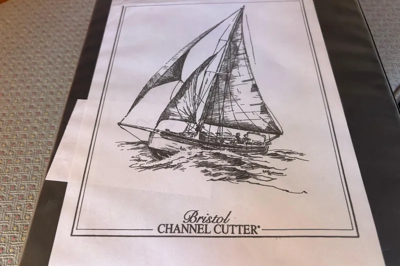 Slide: The Image of Illustration of a 1983 Bristol Channel Cutter 28 sailboat on water. - 51