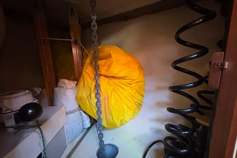 Slide: The Image of Interior of 1983 Bristol Channel Cutter 28 with yellow bag and coiled chain. - 55