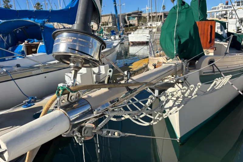Slide: The Image of 1983 Bristol Channel Cutter 28 sailboat docked, showcasing rigging and deck details. - 6
