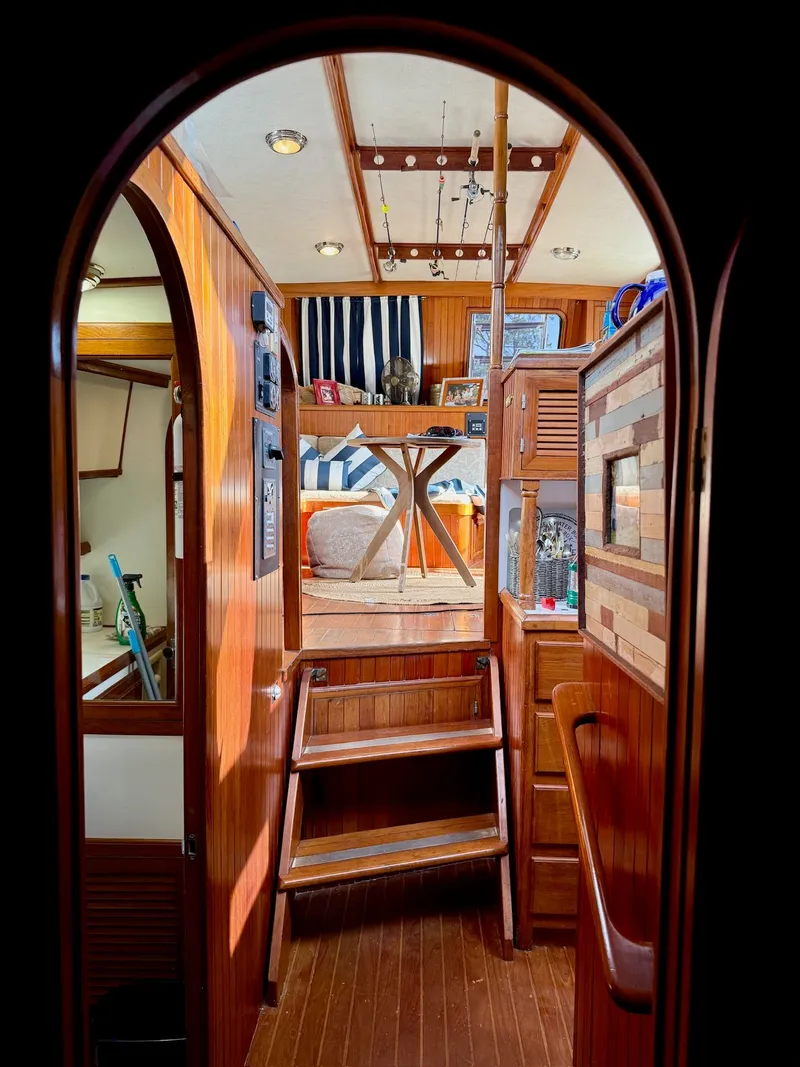 Slide: The Image of Interior of a 1988 PT 42 Yacht with wooden decor. - 10