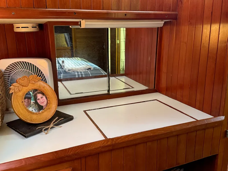 Slide: The Image of Interior of a 1988 PT 42 Yacht with wood paneling. - 13