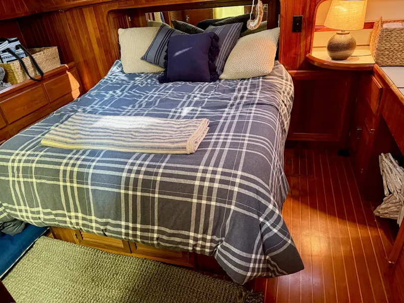 Slide: The Image of Interior of a 1988 PT 42 Yacht featuring a cozy bed. - 15