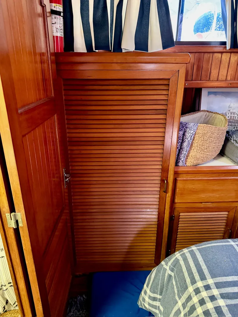 Slide: The Image of Interior of a 1988 PT 42 Yacht with wooden furnishings. - 16