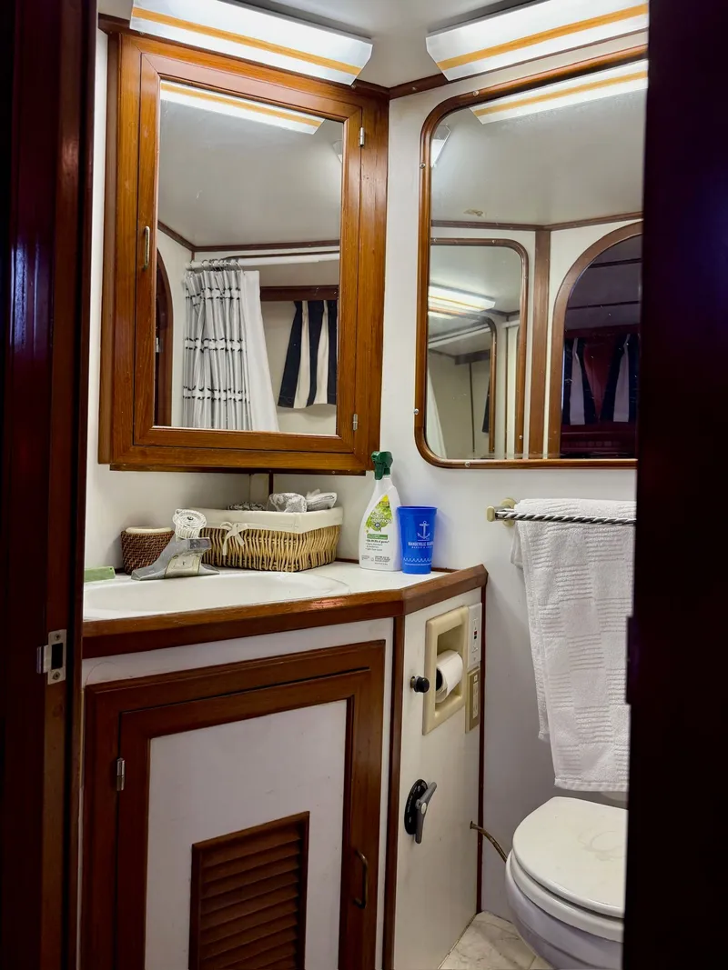 Slide: The Image of Bathroom in PT 42 Yacht, 1988 model, featuring wood trim. - 19