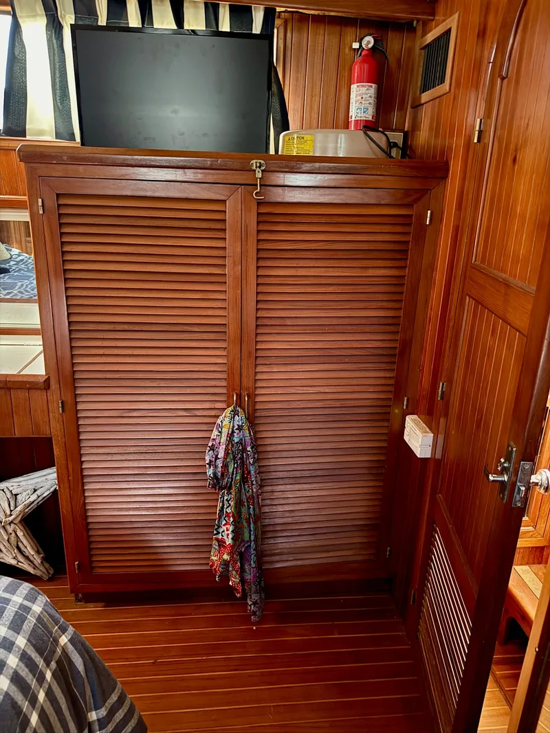 Slide: The Image of Interior of a 1988 PT 42 Yacht with wooden furnishings. - 21