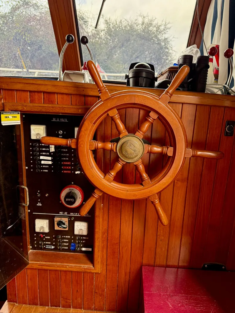Slide: The Image of Steering wheel and control panel of a 1988 PT 42 Yacht. - 23