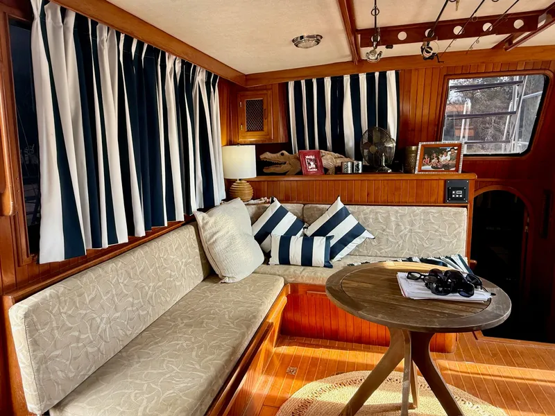 Slide: The Image of Interior of a 1988 PT 42 Yacht with cozy seating area. - 24