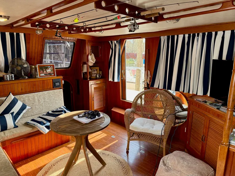 Slide: The Image of Interior of a 1988 PT 42 Yacht with wooden furnishings and nautical decor. - 25