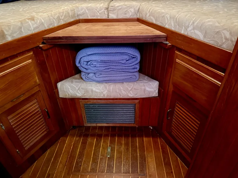 Slide: The Image of Interior of a 1988 PT 42 Yacht with folded blankets. - 34