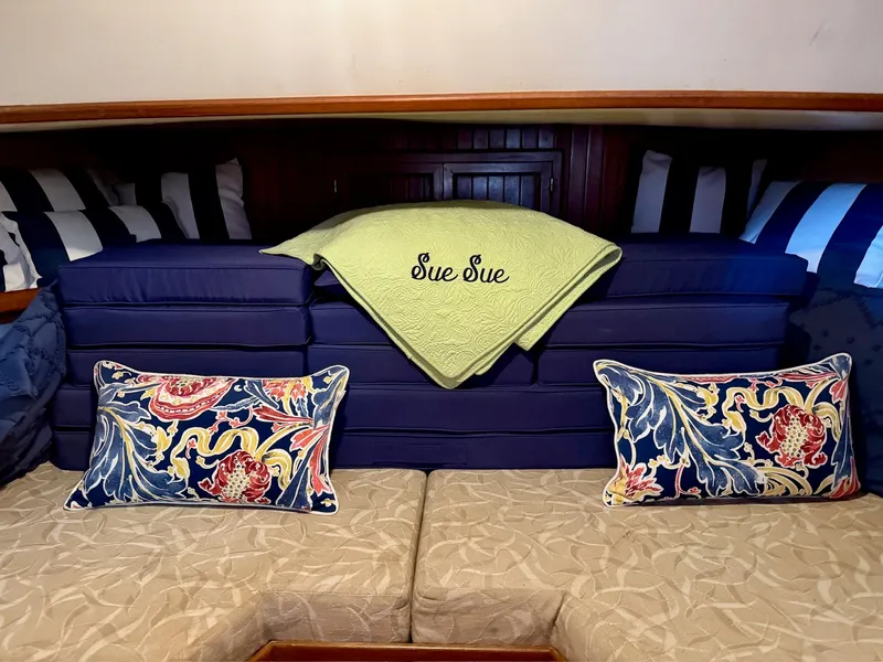 Slide: The Image of Interior of a 1988 PT 42 Yacht with decorative pillows. - 35
