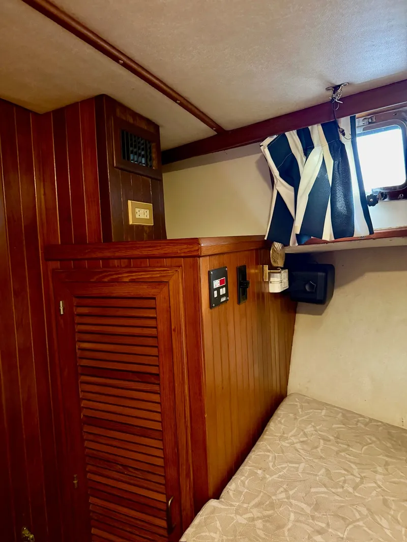 Slide: The Image of Interior of a 1988 PT 42 Yacht with wooden walls. - 37