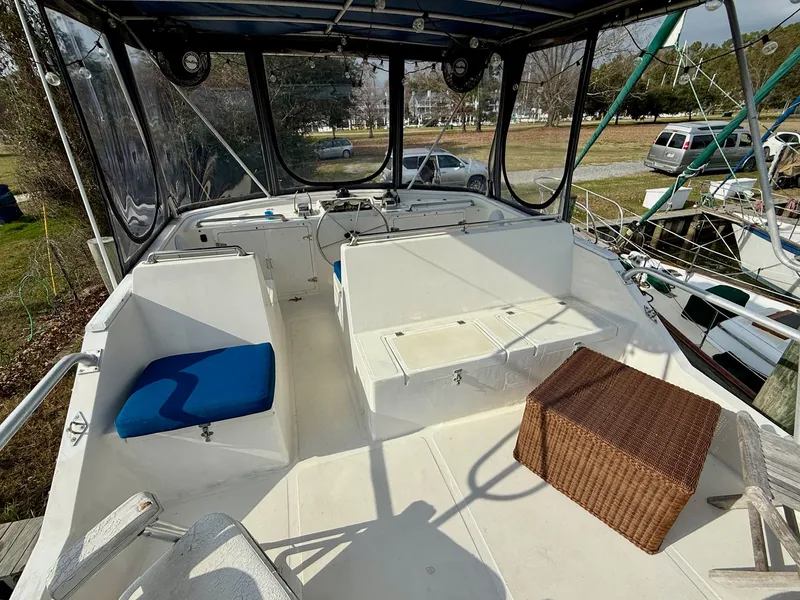 Slide: The Image of Interior of a 1988 PT 42 Yacht with blue seat cushions. - 5