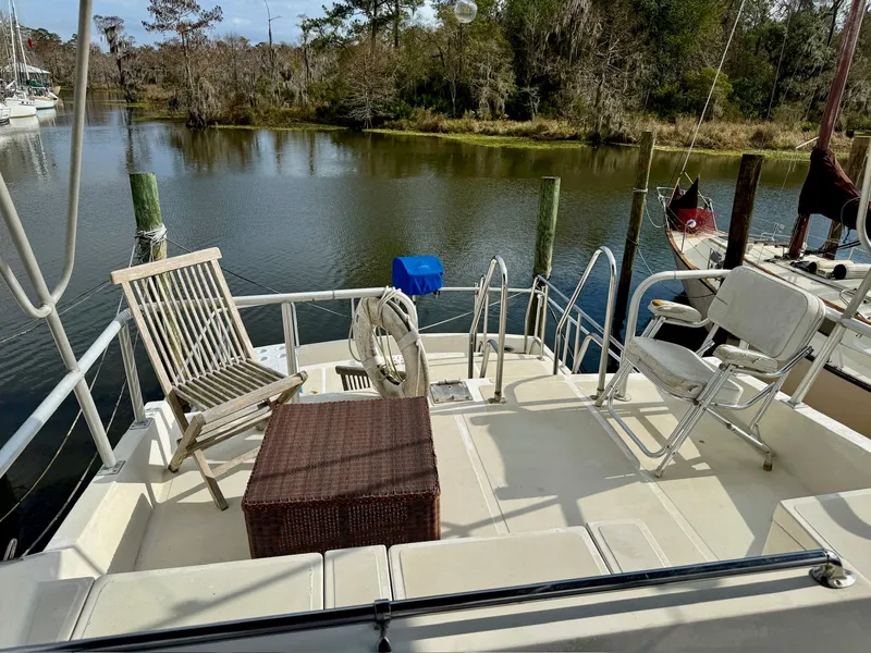 Slide: The Image of Deck of a 1988 PT 42 Yacht with chairs and table. - 9