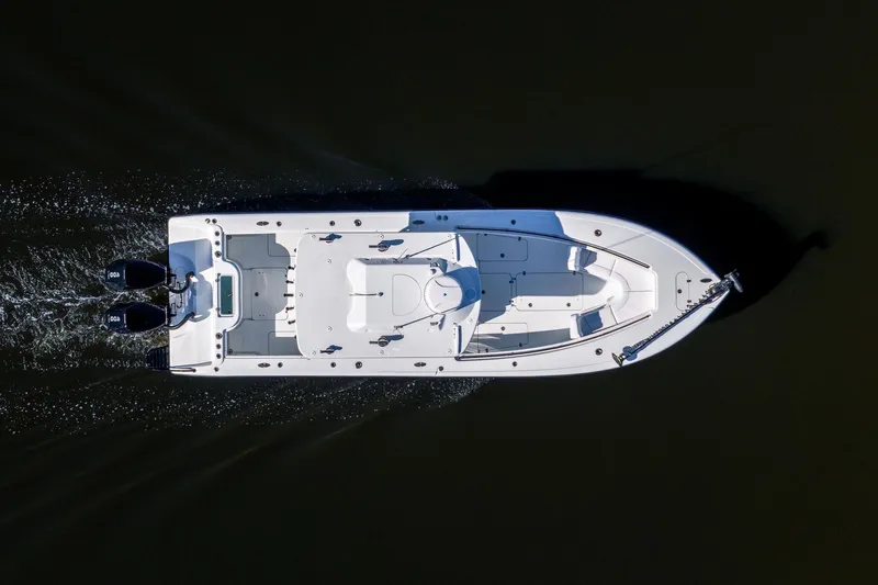 Slide: The Image of Aerial view of 2023 Yellowfin 32 Offshore boat cruising on dark water. - 24