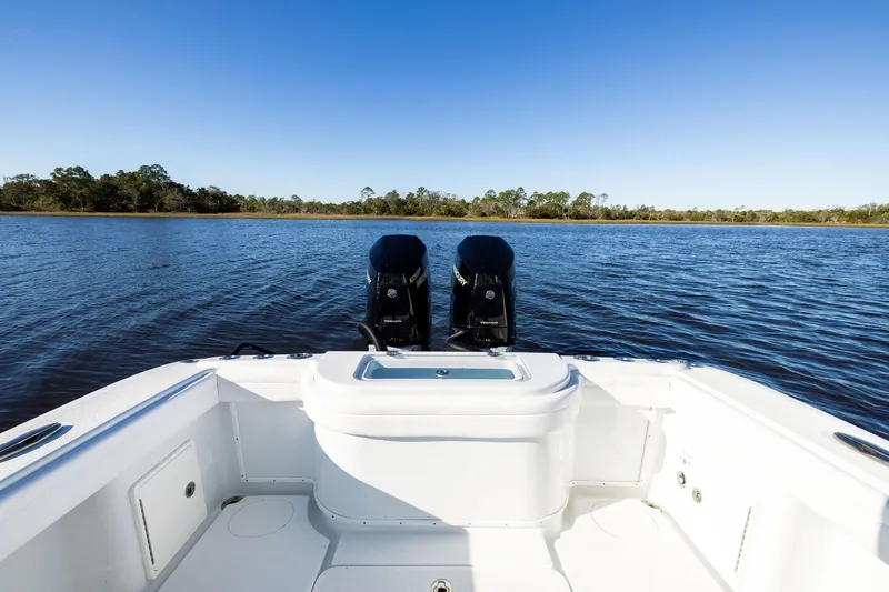 Slide: The Image of 2023 Yellowfin 32 Offshore boat with dual engines on a calm lake. - 25