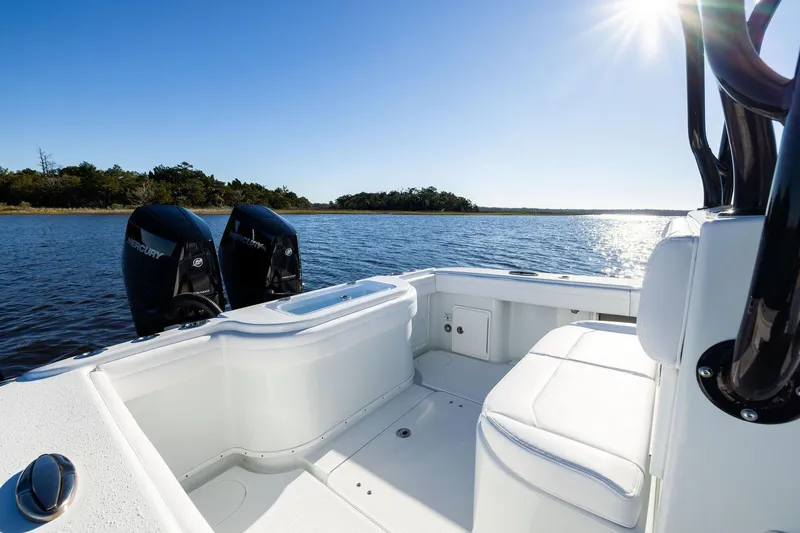 Slide: The Image of 2023 Yellowfin 32 Offshore boat interior with twin Mercury engines on a sunny day. - 27