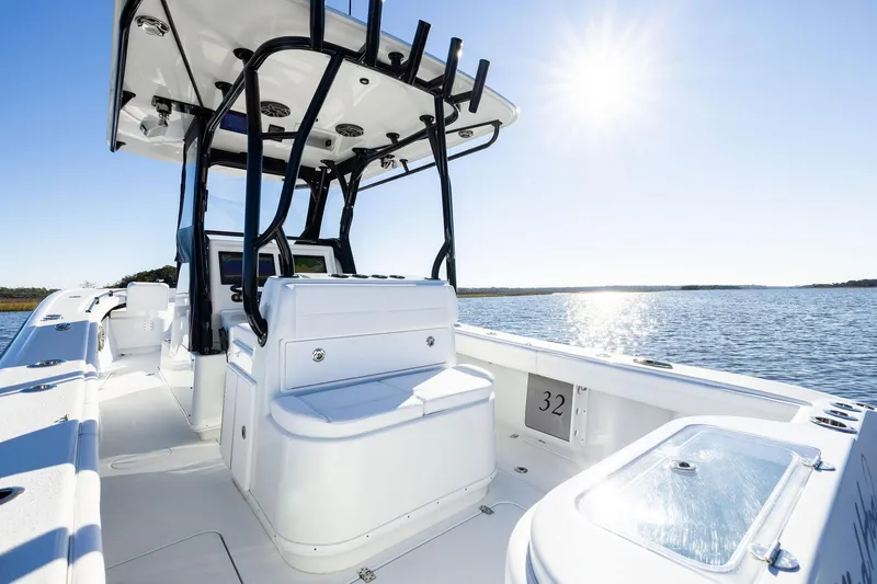 Slide: The Image of 2023 Yellowfin 32 Offshore boat interior with sunny ocean view. - 32