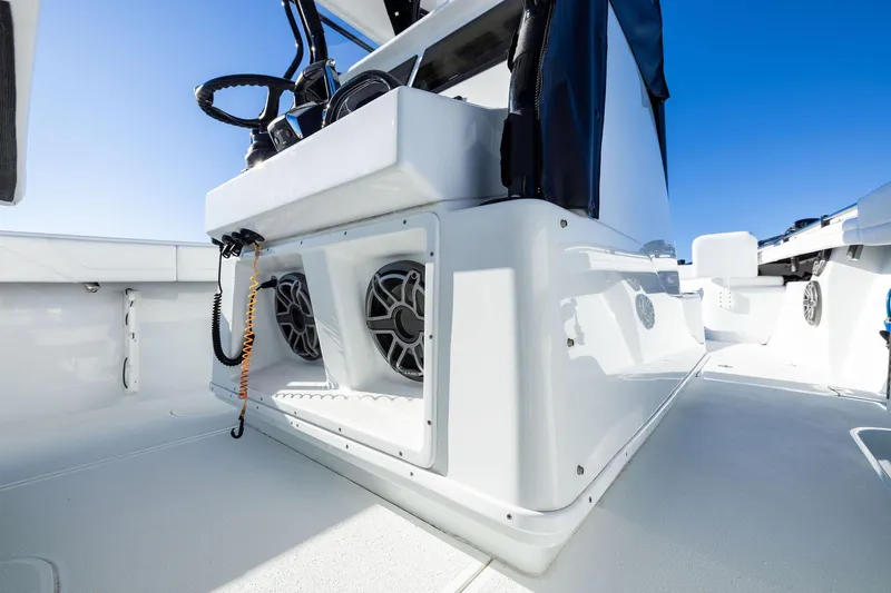 Slide: The Image of 2023 Yellowfin 32 Offshore boat interior with speakers and control panel. - 44